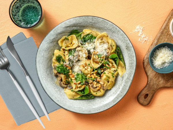 Cheese Tortellini Served with Italian Sausage and Mushroom-Spinach Cream