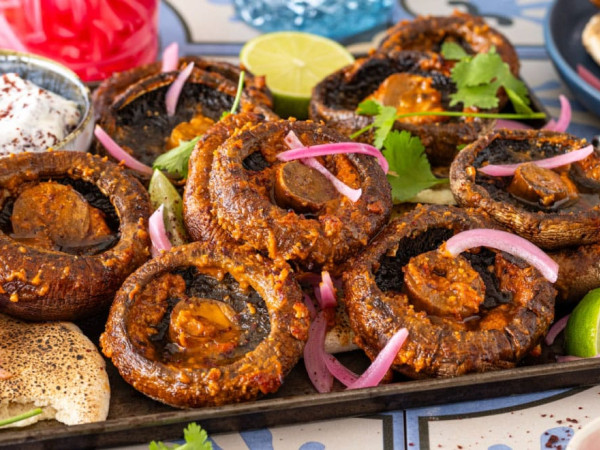 Grilled Portobello Caps Served with Mashed Cannellini Beans and Spicy Harissa